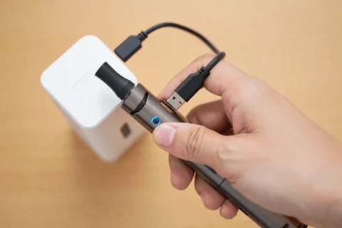 exploded view of gold vape device showing battery, coil and mouthpiece